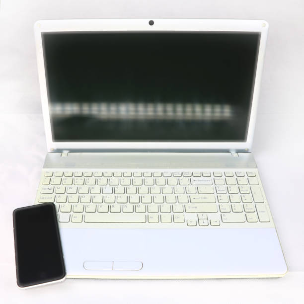 istock white laptop and smartphone on a light background 1069977950