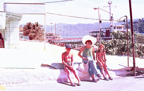 Vintage family on summer vacations. Vintage image of a mother and her children in a little mexican town during a summer vacation in the seventies. beautiful mexican girls stock pictures, royalty-free photos & images