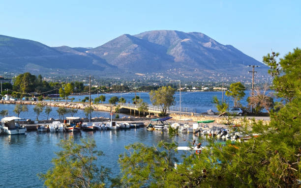 пейзаж эретрия, как видно из dreams острова euboea греции - fishing boat стоковые фото и изображения