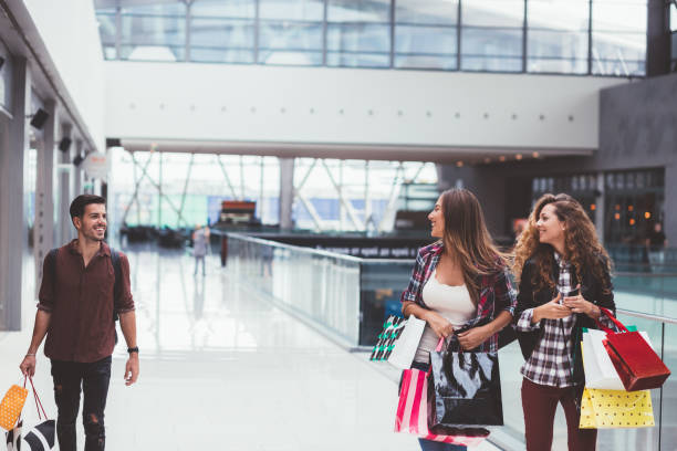 istock Friends in the shopping mall 1069984904