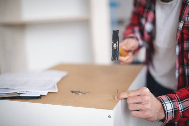 istock Young man making his own furniture 1069984988