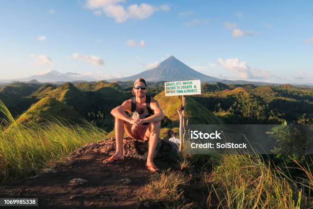 Tourist Visiting Chocolate Hills Stock Photo - Download Image Now - Hiking, Philippines, Quotation - Text