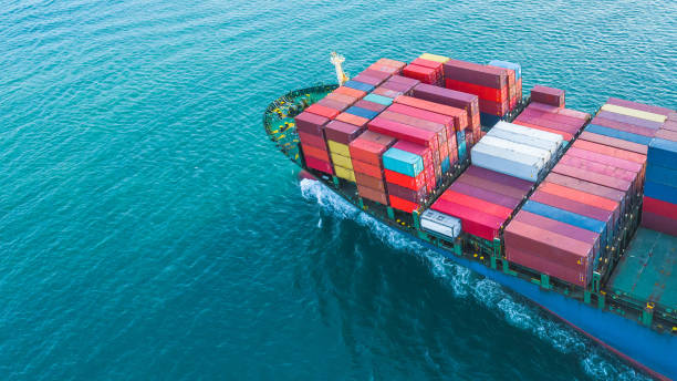 istock Aerial view container cargo ship, business freight shipping international by container cargo ship in the open sea. 1069986548