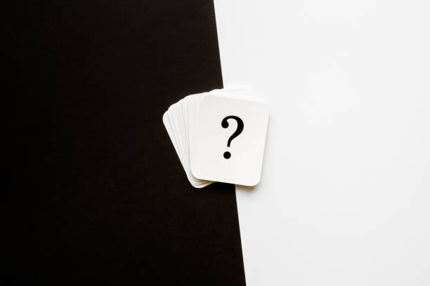 istock Card of question mark on black and white background. Copy space. Empty place for text, plans, thoughts or other good and not so good ideas for making decision. Pros and cons concept. 1069988272