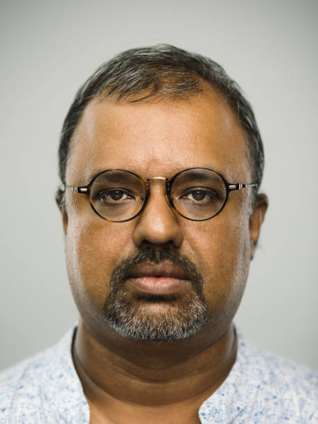 настоящий индийский мужчина с пустым выражением - portrait human face men overweight стоковые фото и изображения