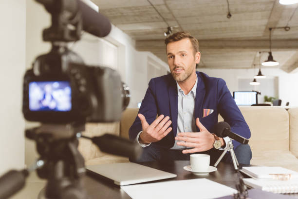 istock Businessman making a video blog 1069993218