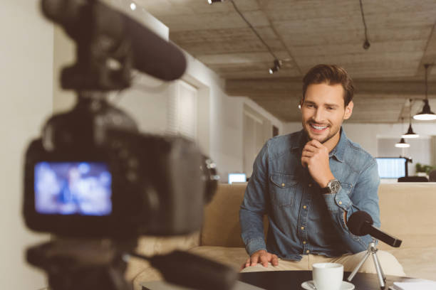 istock Handsome man making video blog 1069993510