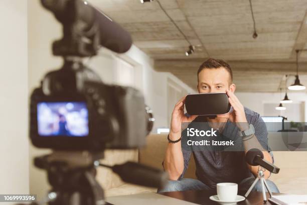 Vlogger Making Video On Vr Goggles Stock Photo - Download Image Now - Discussion, Merchandise, Vlogging