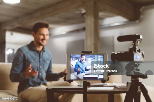 Male Vlogger Recording Content On Camera Stock Photo - Download Image Now - Home Video Camera, Contented Emotion, Social Media