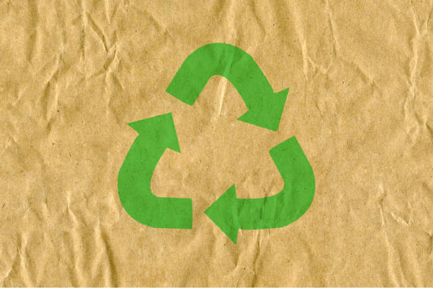 istock Symbol for refuse reuse recycle with cardboard background 1069994010