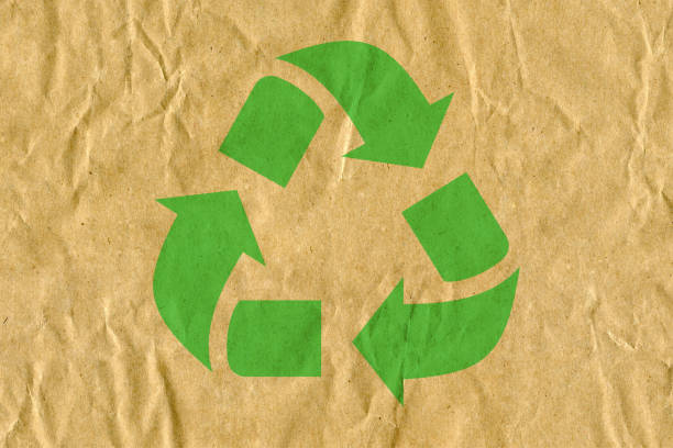 istock Symbol for refuse reuse recycle with cardboard background 1069995898