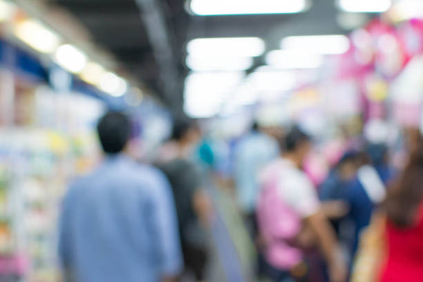 istock Abstract people walking in exhibition blurred background 1069996044