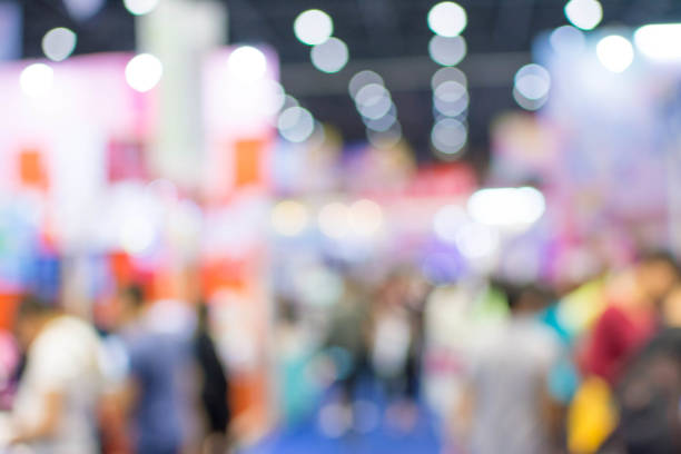 istock Abstract people walking in exhibition blurred background 1069996090