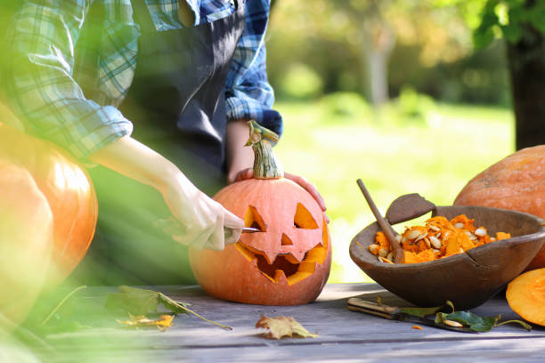 istock carve pumpkins for Halloween 1069997338