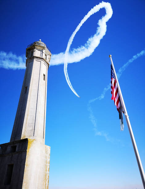 smoke of exhibition plane in alcatraz. san francisco - blue angels imagens e fotografias de stock