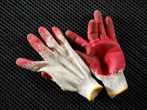 istock Half-coated gloves to protect hands 1069999990