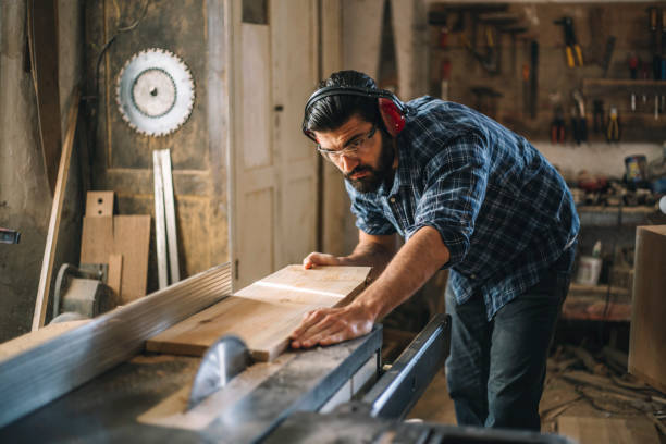 istock Carpenter cutting wooden plank 1070000294
