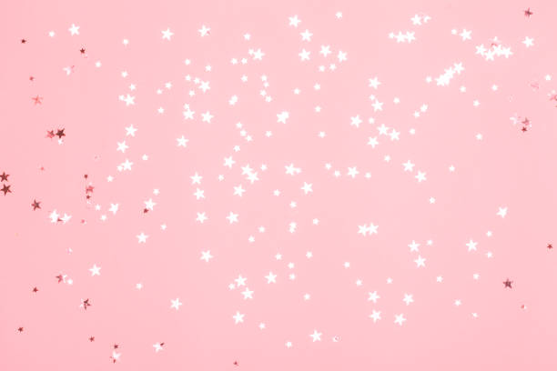 istock Pink confetti and stars and sparkles on pink background. 1070000522
