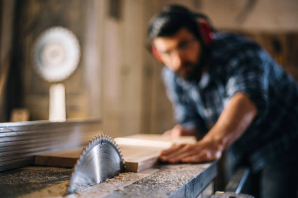 istock Carpenter cutting wooden plank 1070000602