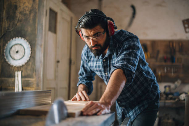 istock Carpenter cutting wooden plank 1070002132