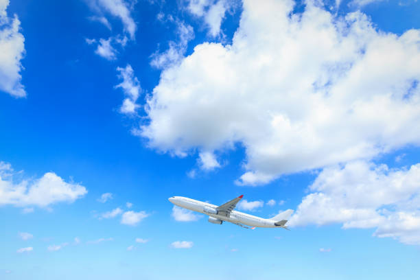 istock Airplane flying in the blue sky 1070006610
