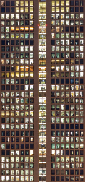 istock facade of skyscraper in the evening with offices as symbol for work 1070006988