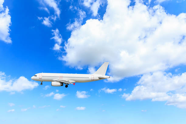 istock Airplane flying in the blue sky 1070008952