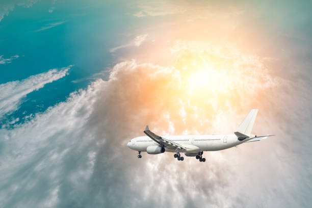 istock Airplane flying in the blue sky 1070009526