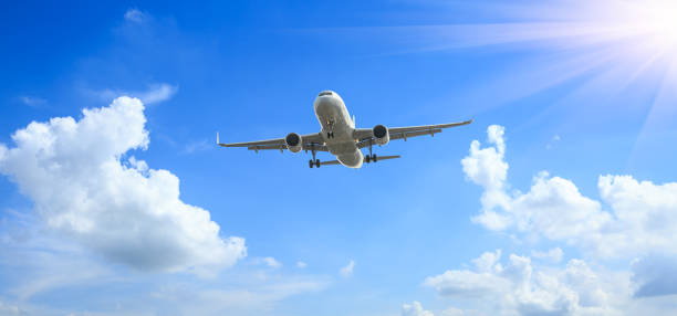 istock Airplane flying in the blue sky 1070013390