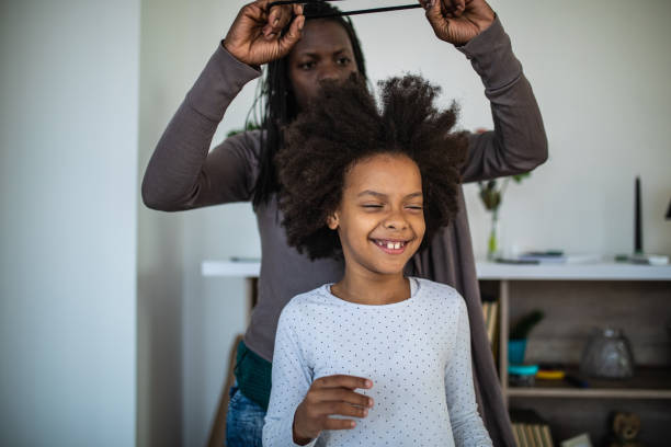 istock Mother styling daughters hair 1070015014