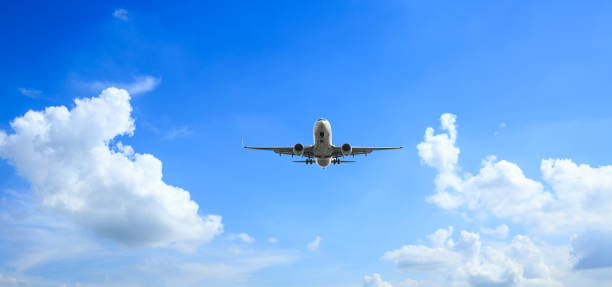 istock Airplane flying in the blue sky 1070015202