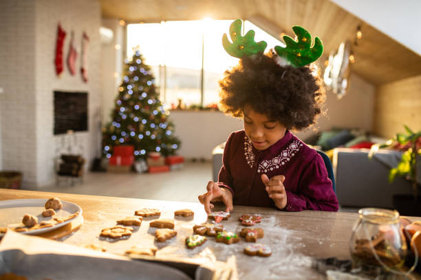 istock Girl decorating Gingerbread cookies 1070015376