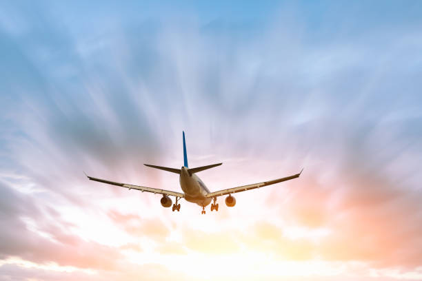 istock Airplane flying in the blue sky 1070016298