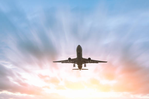 istock Airplane flying in the blue sky 1070016326
