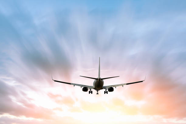 istock Airplane flying in the blue sky 1070016560