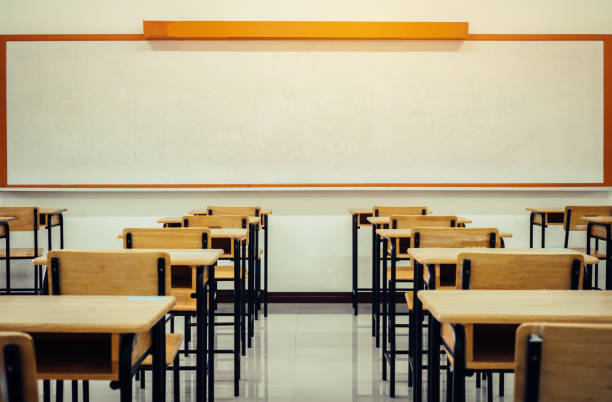 istock Back to school concept. School empty classroom, Lecture room with desks and chairs iron wood for studying lessons in highschool thailand without young student, interior of secondary education 1070026048