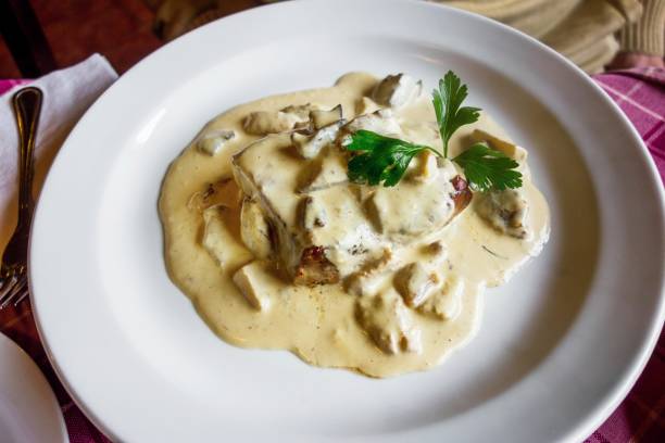istock Mushroom sauce with pork sliced pork on plate. 1070027568