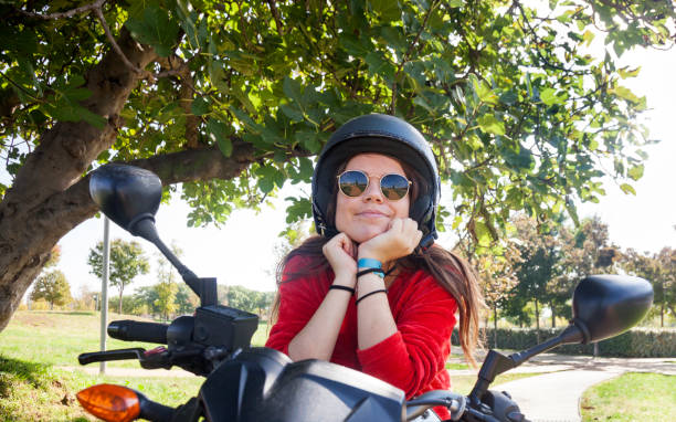 istock Happy girl with motorcycle 1070030548