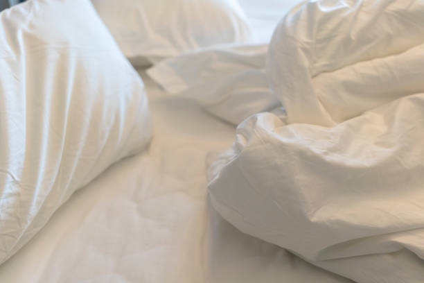 Green and White pillows on a bed Comfortable soft pillows on the bed