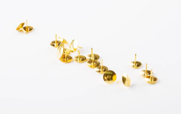 istock Closeup metal tacks on a white. Office concept 1070032862