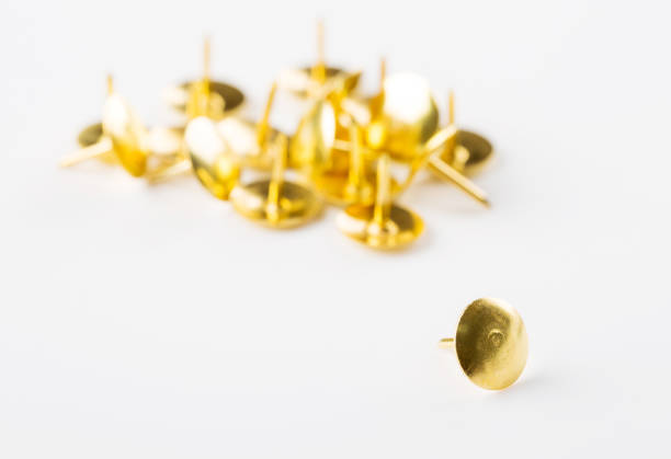 istock Closeup metal tacks on a white. Office concept 1070032866