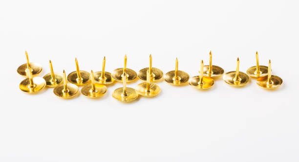 Closeup metal tacks on a white. Office concept