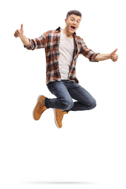 istock Young guy jumping and showing thumbs up 1070033474