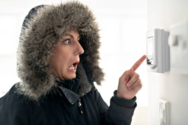 istock Woman With Warm Clothing Feeling The Cold Inside House 1070035626