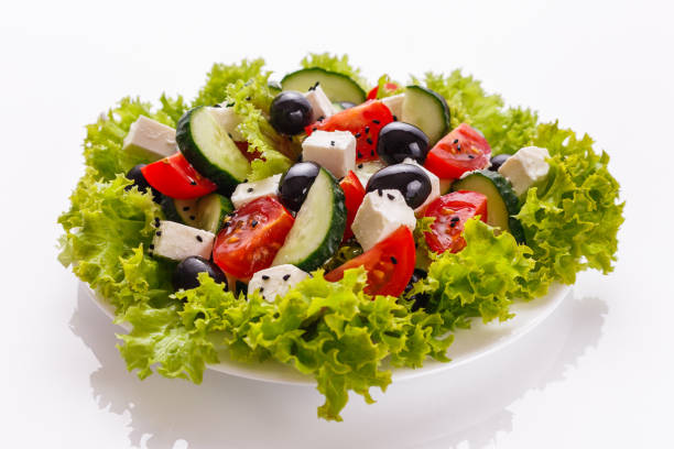 istock Greek salad on a white acrylic background 1070036962