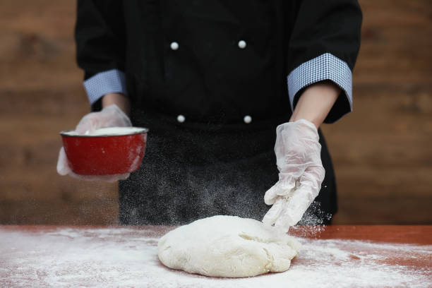 istock the cook makes flour for baking on the table 1070037966