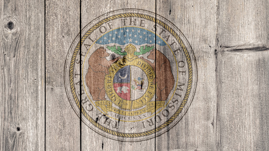 USA Politics News Concept: US State Missouri Seal Wooden Fence Background