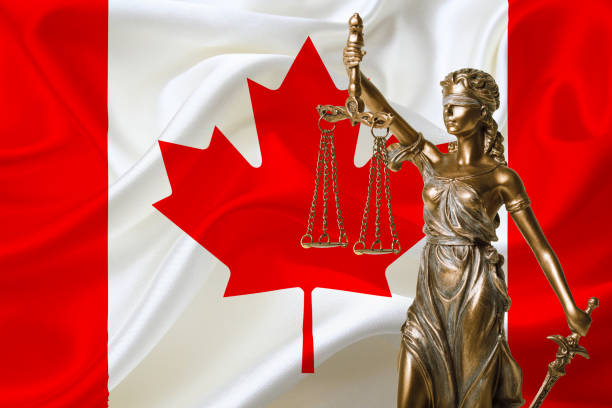 istock statue of justice and canada flag 1070041994