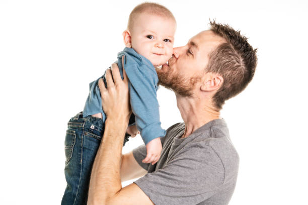 istock Father with cute baby on studio white background 1070043778