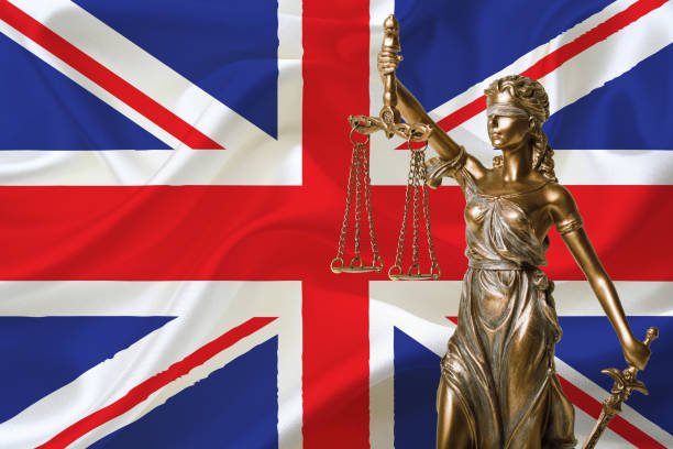 istock statue of justice and england flag 1070045922